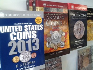 Coin and stamp supplies including coin reference books