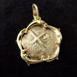 Colonial Spain 2 Reales with a 14 carat gold bezel